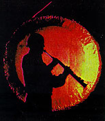 Paul Winter and the Sun Gong during the Winter Solstice Celebration. Photo &copy; Jeff Day